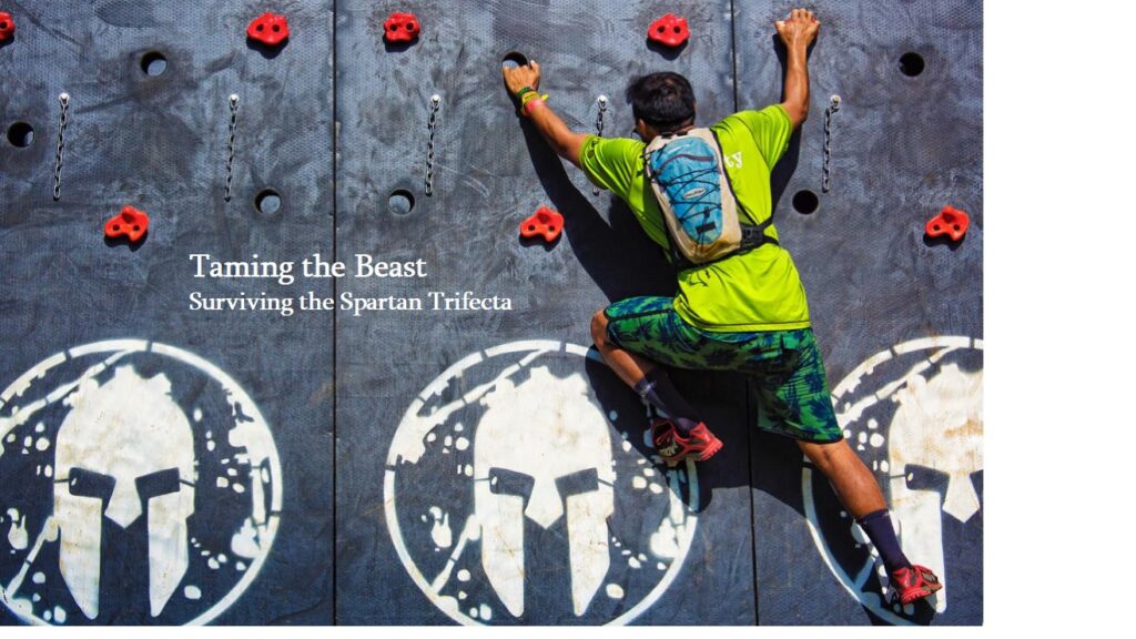 Competitor navigates a climbing wall, one of many difficult obstacles found in a Spartan Race